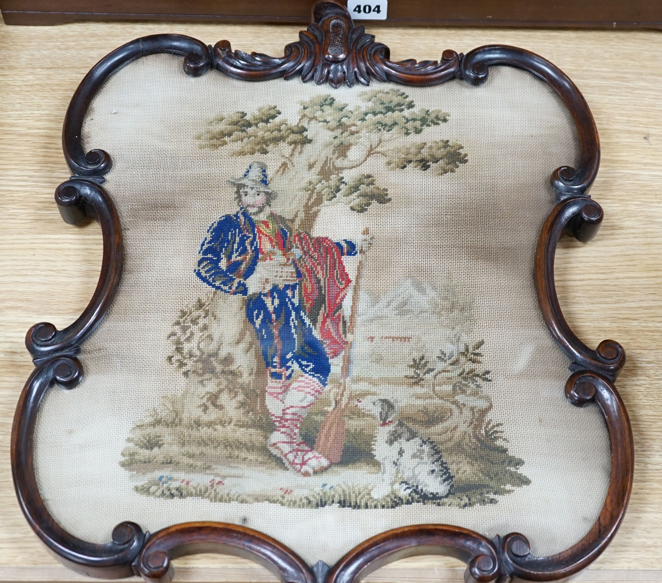 A 19th century petite point framed screen (without pole) of a man and a dog